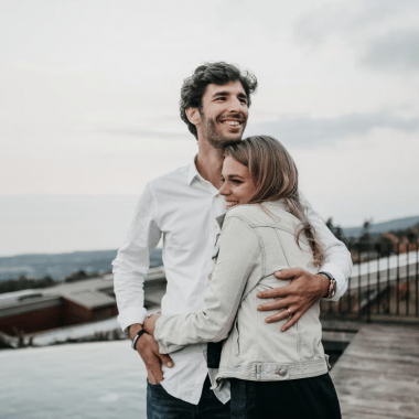 Man holding woman.